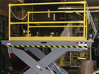 Dock lift image showing an alternative to a forklift ramp that raises and lowers the forklift to the height of the truck also connected to a yard ramp