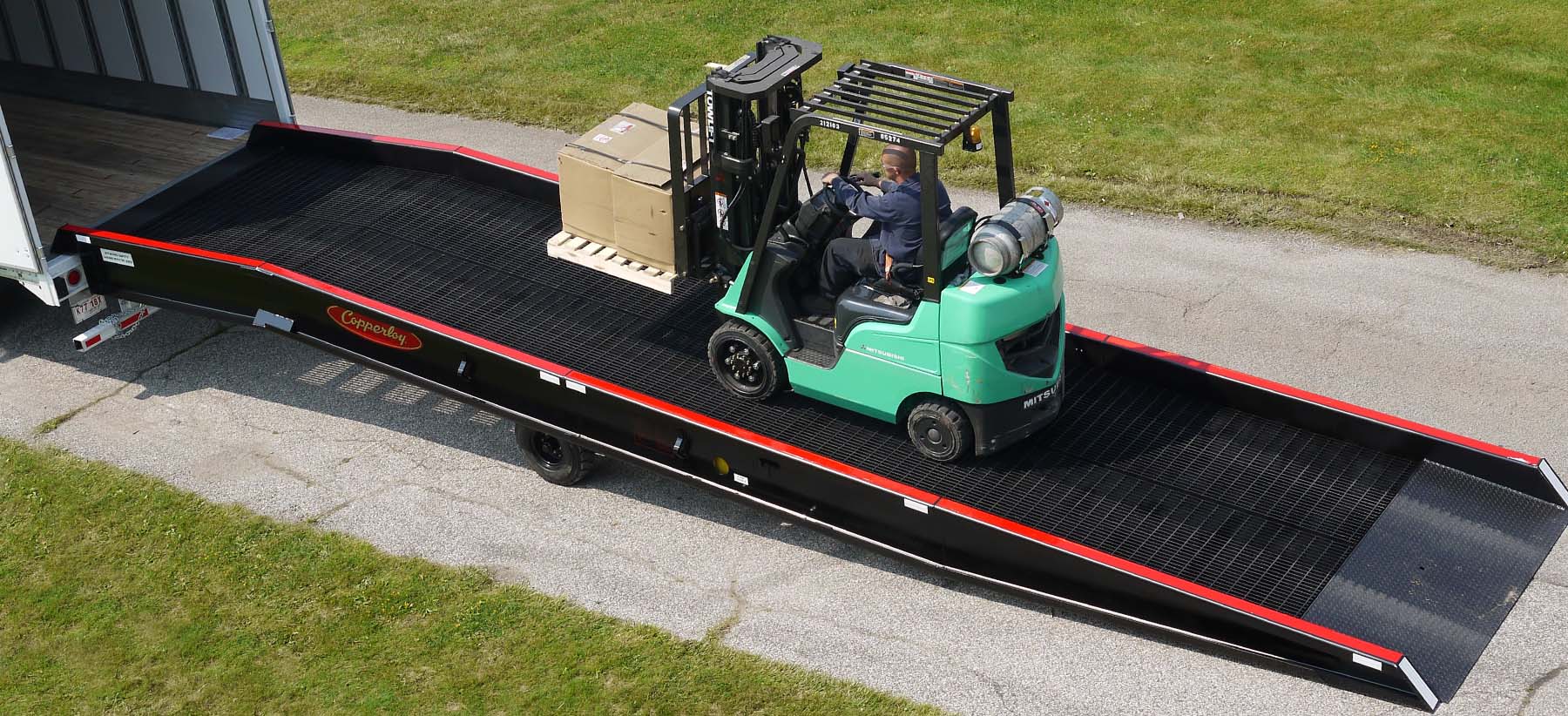 forklift on a portable yard ramp