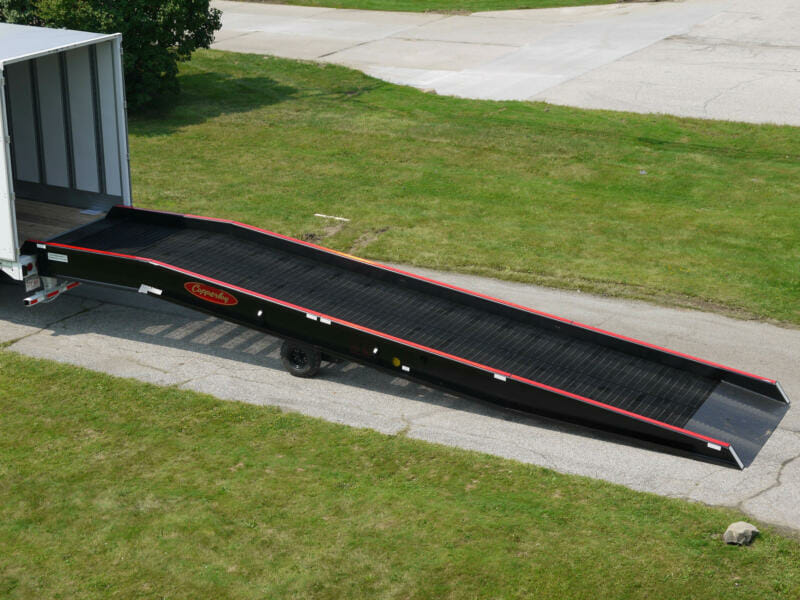 Copperloy single acting hydraulic ramp linked to a truck trailer.